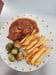 La Taverne - Un sauté de porc à la provençale, choux de bruxelles et frites maison.