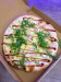 Maud's - Une pizza aux 4 fromages de savoie avec des filets de poulet et une sauce barbecue pour la pointe de gourmandise 